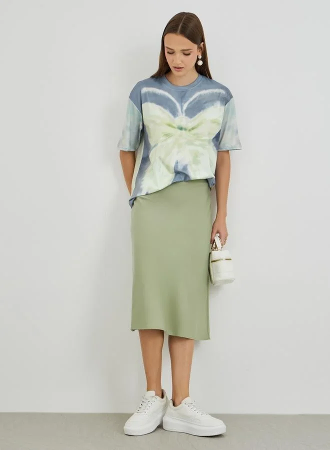 تايك تو تيشيرت واسع بأكمام قصيرة وطبعة جرافيك